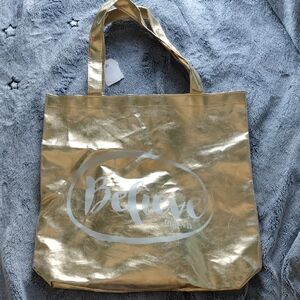 Elegant Gold Tote Bag with 'Believe' Design